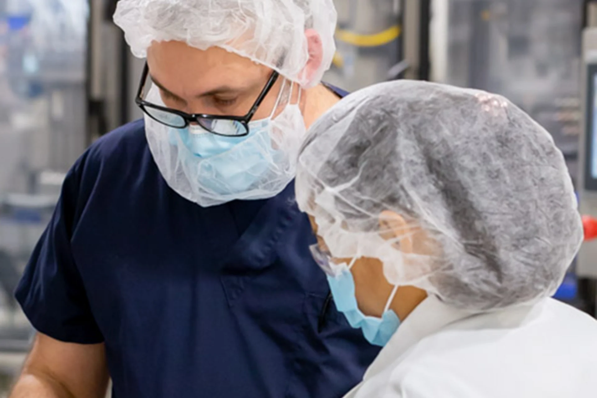 Two Peak team members working together in a production area