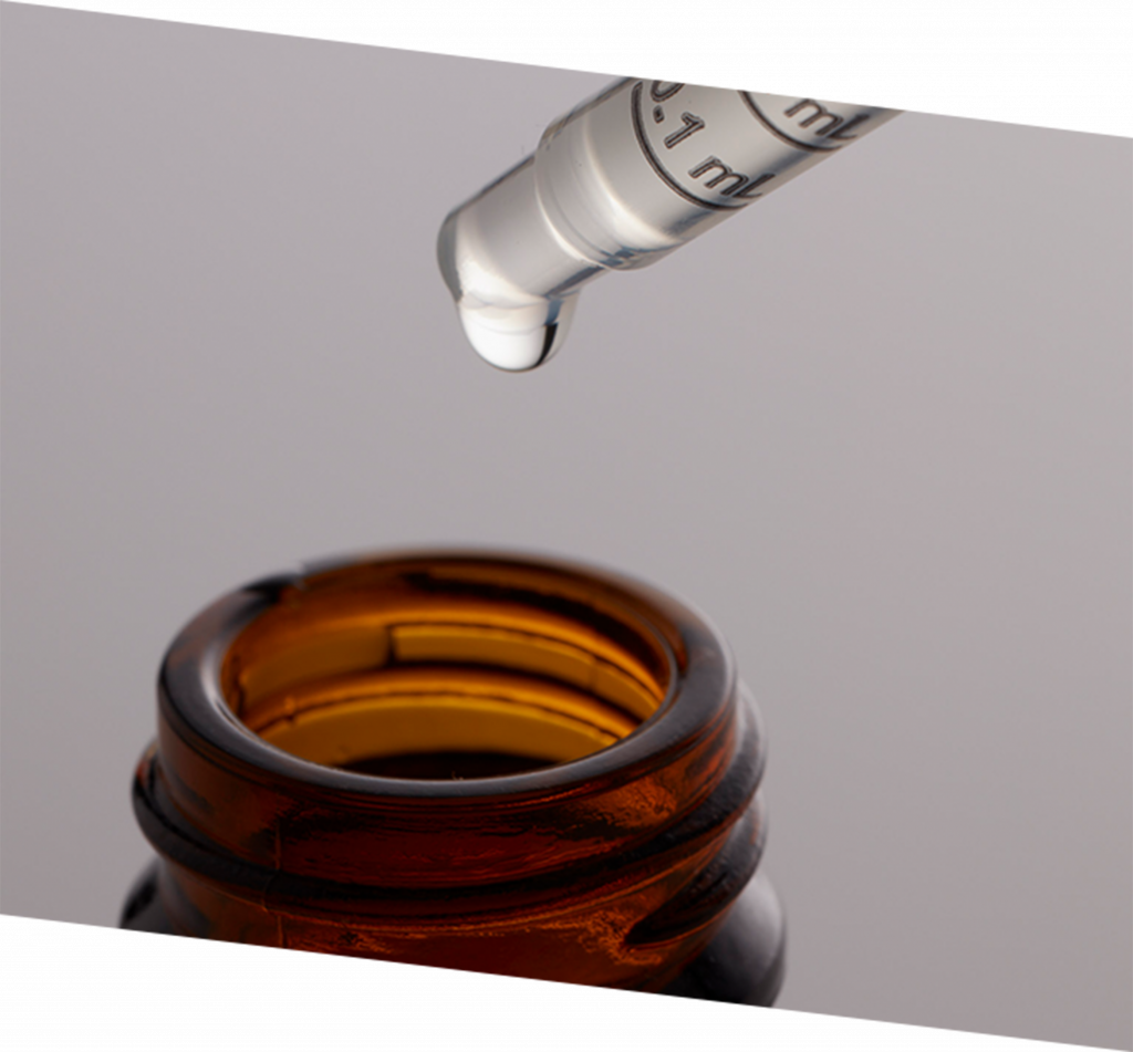 Illustrative image of an oil dropper and bottle